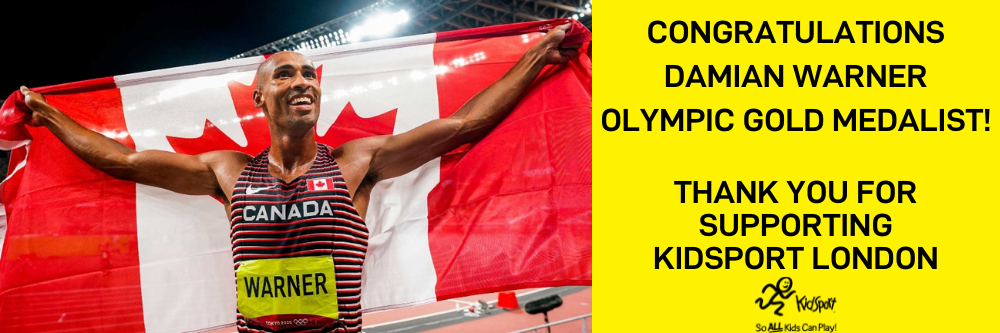 Damian Warner carrying Canada flag during Tokyo 2020