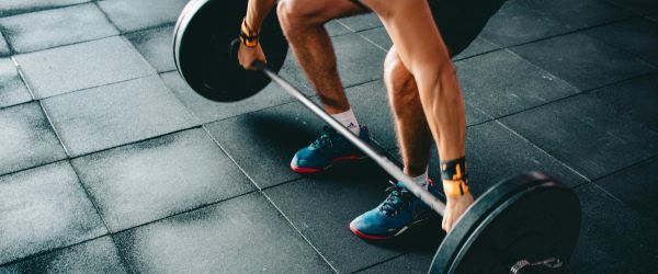 Man deadlifting at gym